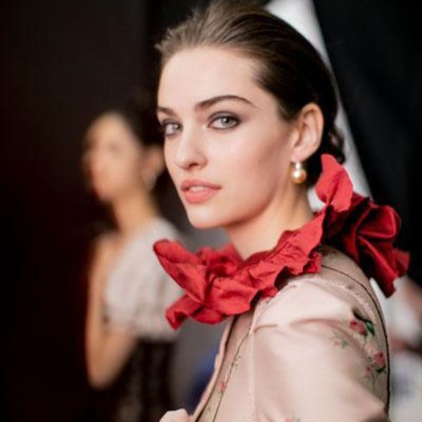 Model wearing a Brock collection dress on the runway