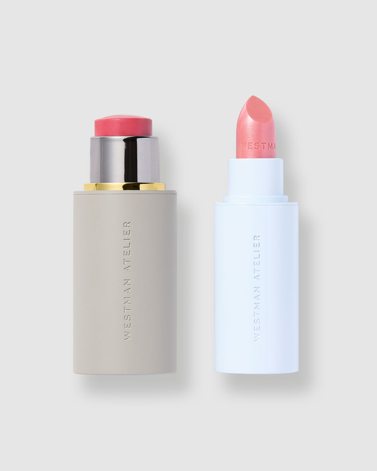 Two cosmetic products with pink caps on a light gray background