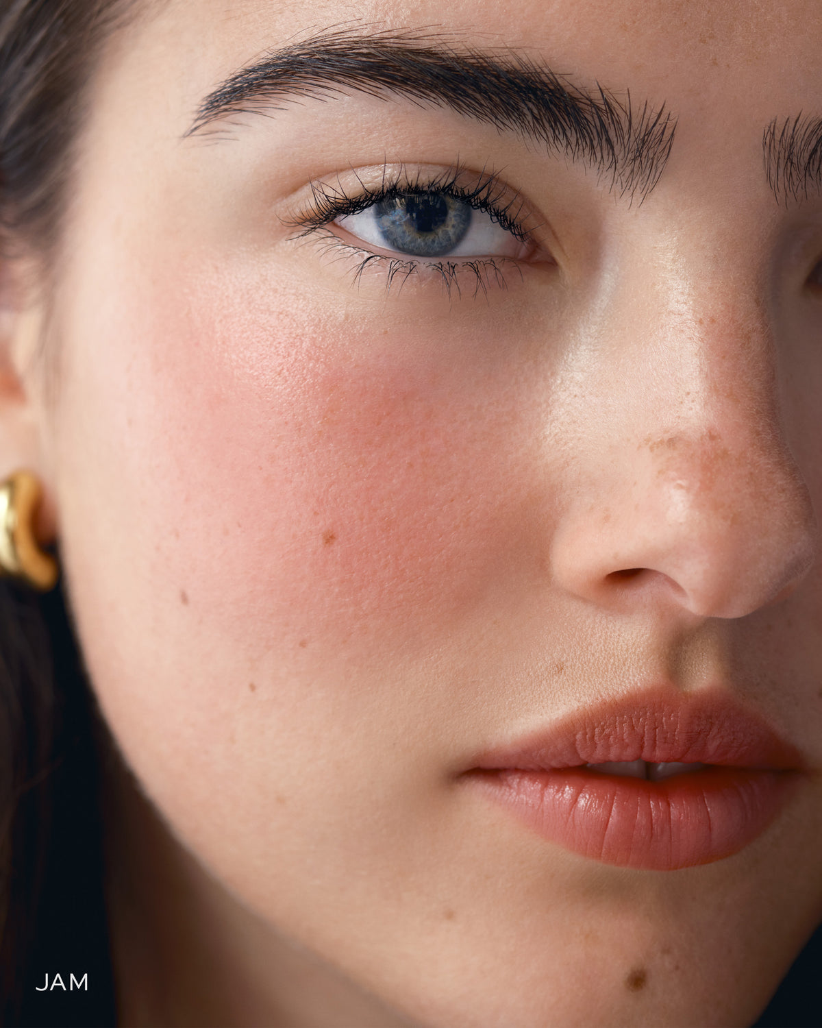 Close-up of a model's face wearing Baby Cheeks. 