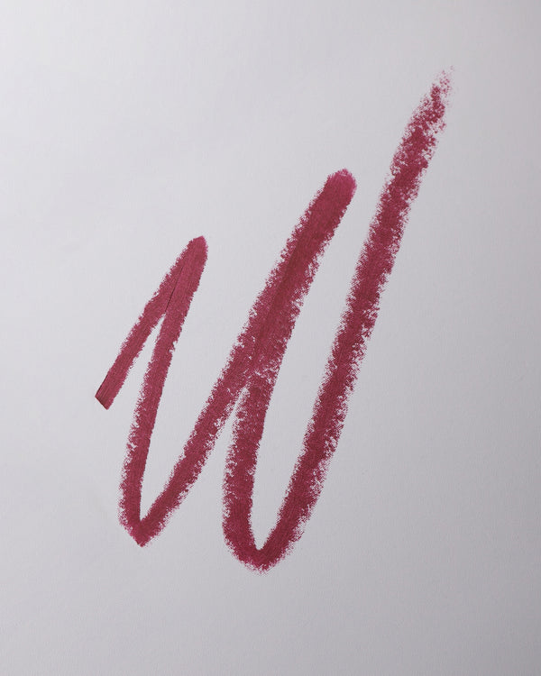 Lip liner swatch in Lou Lou on grey background.