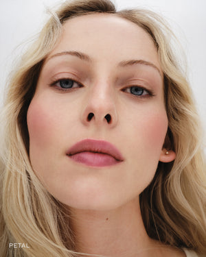 Close up of model wearing Petal Baby Cheeks. 