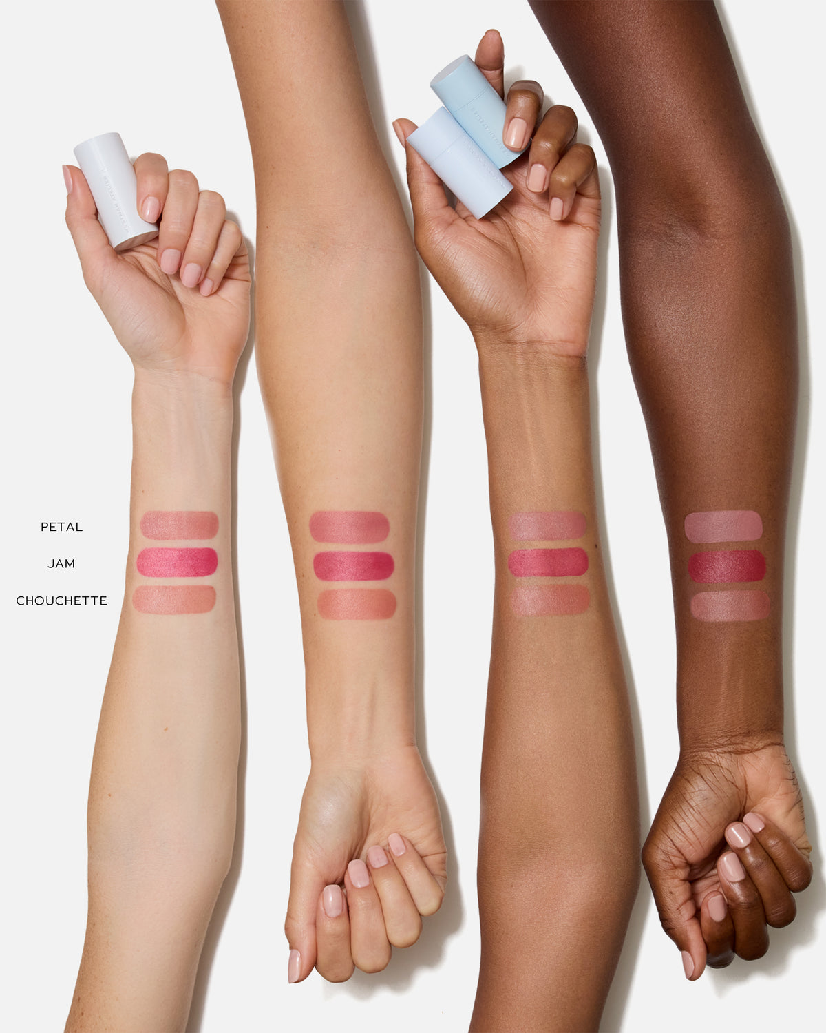 Three arms with swatches of blush on a white background