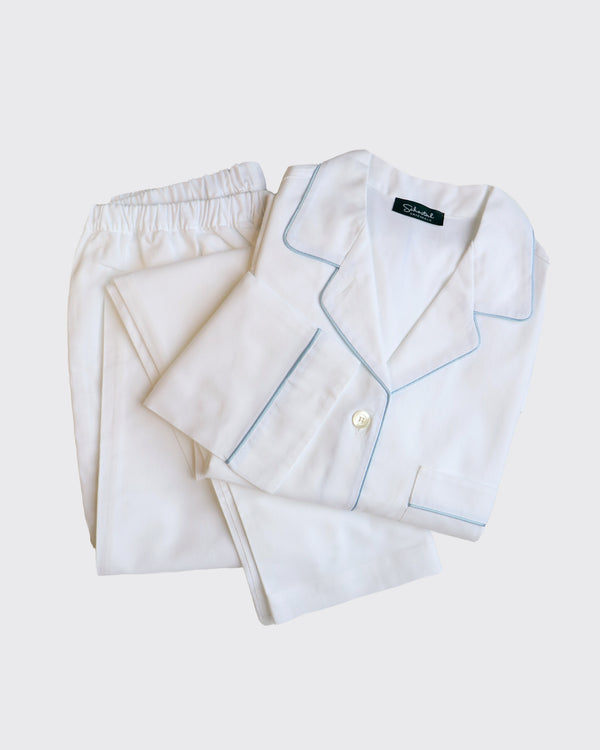 White pajama set with light blue piping on a white background